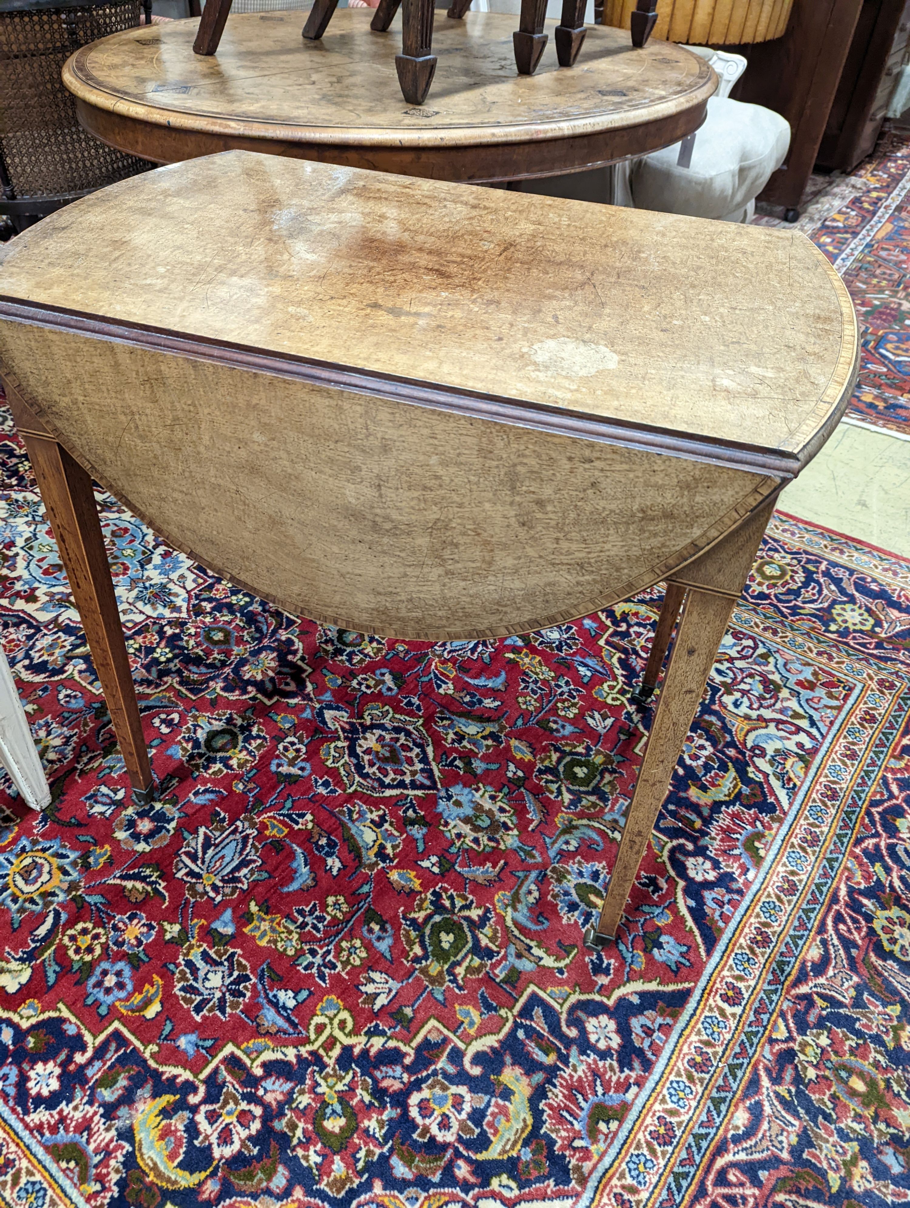 A George III satinwood banded mahogany oval topped Pembroke table, width 48cm, depth 70cm, height 71cm